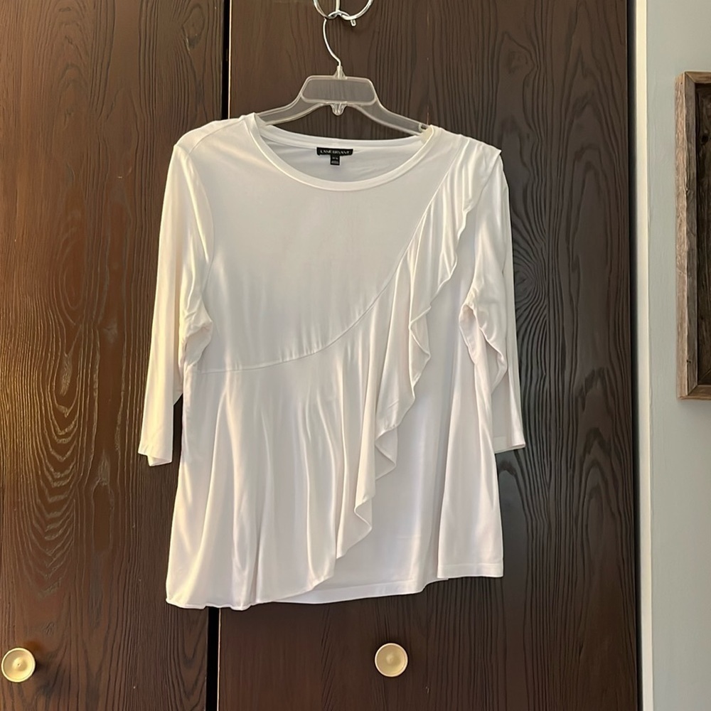 Lane Bryant 3/4 sleeved white top with large ruffle on front. Size 14/16.